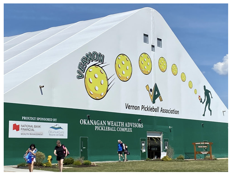 Indoor pickleball courts with players under a large white dome; exterior of the dome with Vernon Pickleball Association logo.