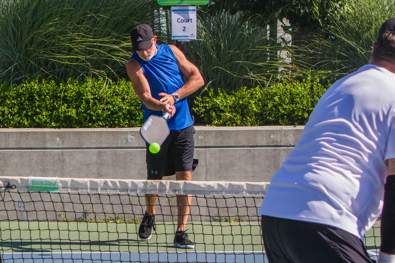 On-court officiating during a pickleball tournament in British Columbia.