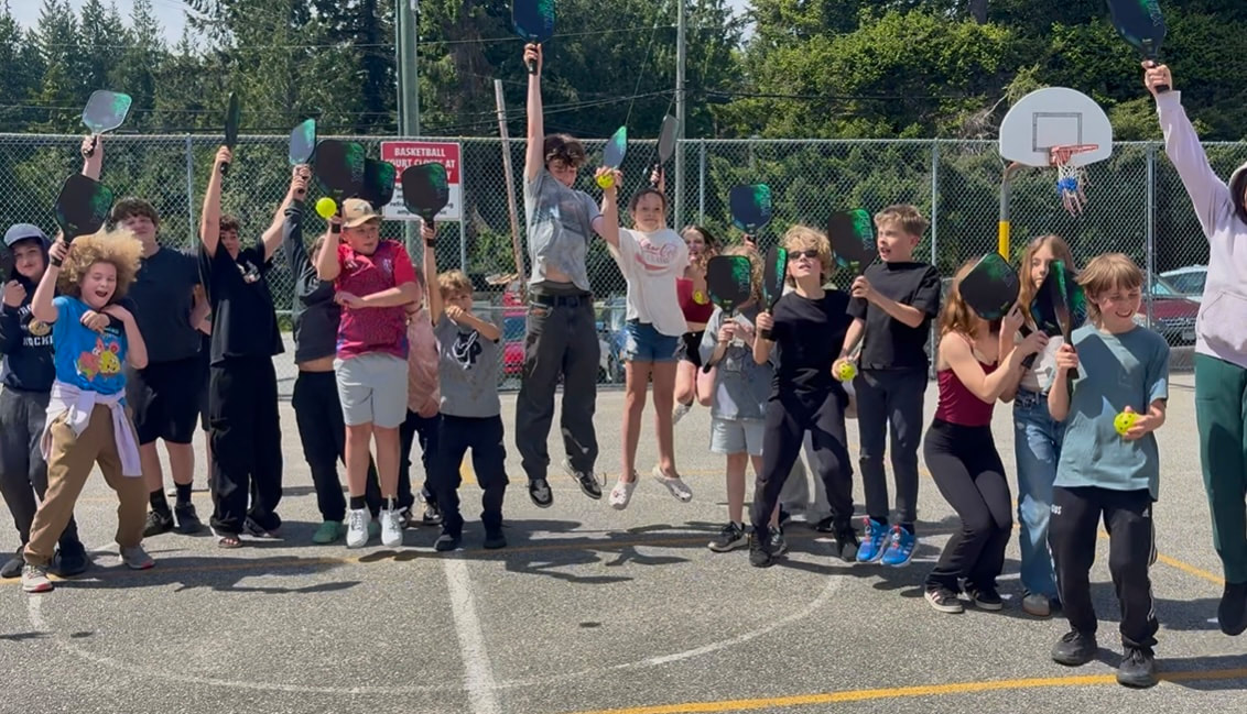 Robert's Creek Elementary students receiving pickleball equipment