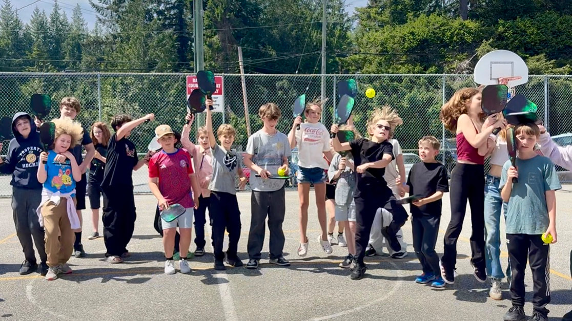 Robert's Creek Elementary students receiving pickleball equipment